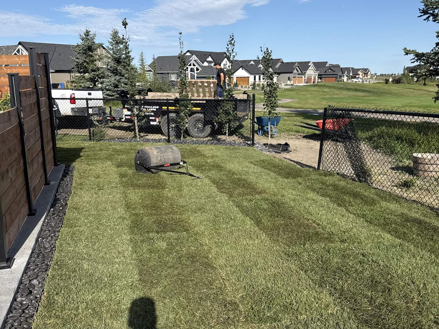 New sod laid and rolled on the rebuilt base